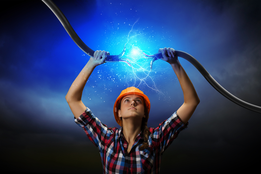 a woman holding electricity cable above head